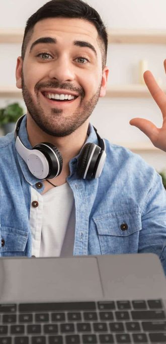 cheerful-man-having-video-call-using-laptop-and-wa-2022-02-03-00-27-59-utc-1.jpg